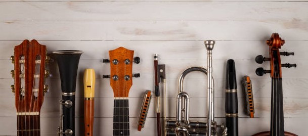 musical instruments in white wooden background